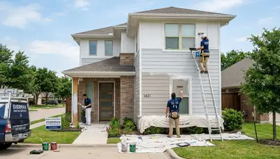 Professional house painters working on residential exterior in Fort Worth, TX