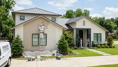 Professional house painters working on residential exterior in Fort Worth, TX