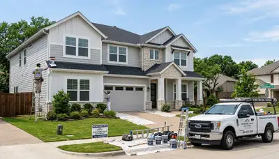 Professional house painters working on residential exterior in Fort Worth, TX