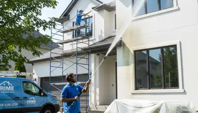 Professional pressure washing a Fort Worth TX home exterior by local house painters